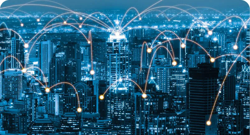 Digitally connected city at night with glowing data connections